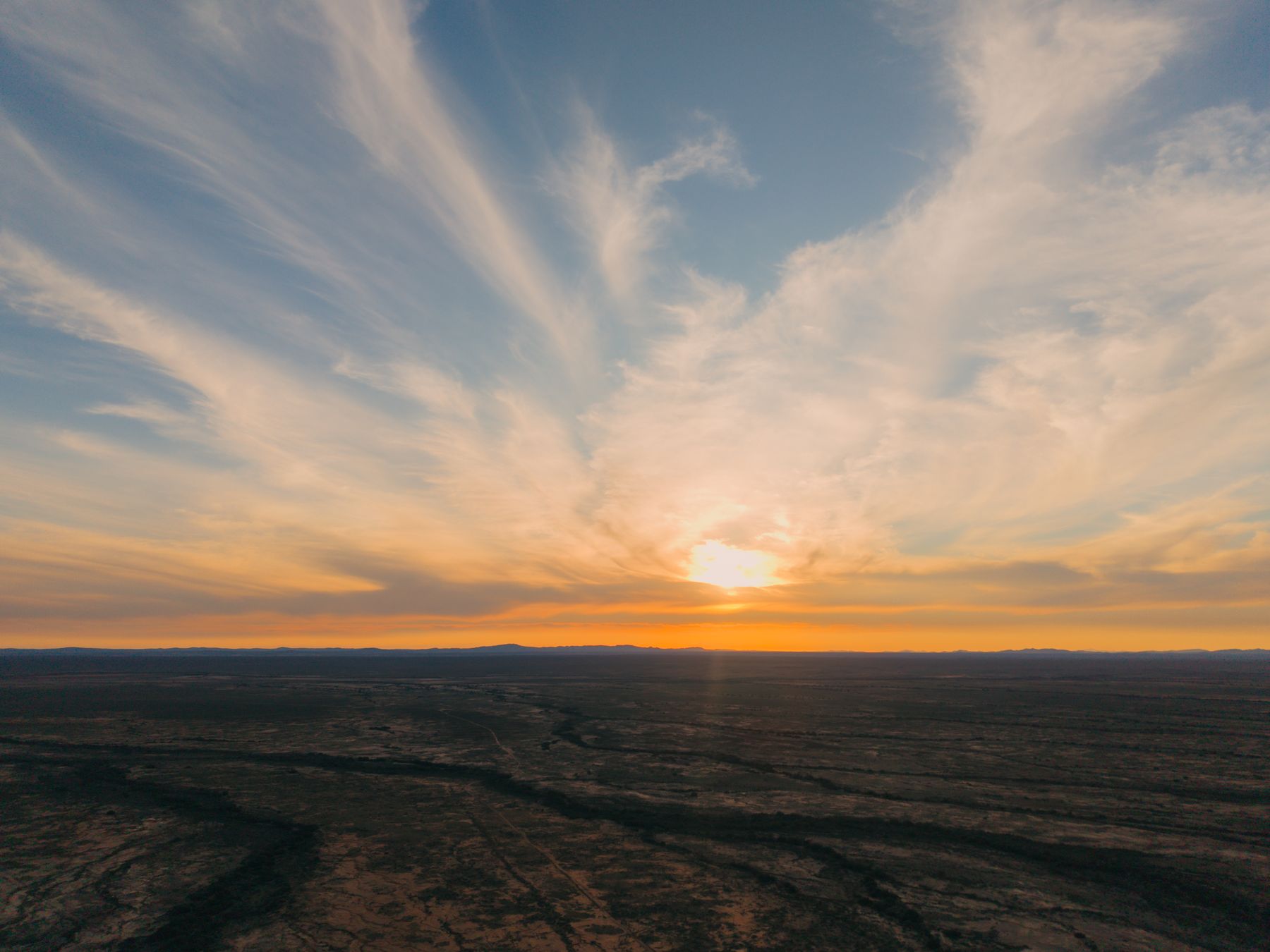 Sunset over the Knersvlakte plain under streaked cloud